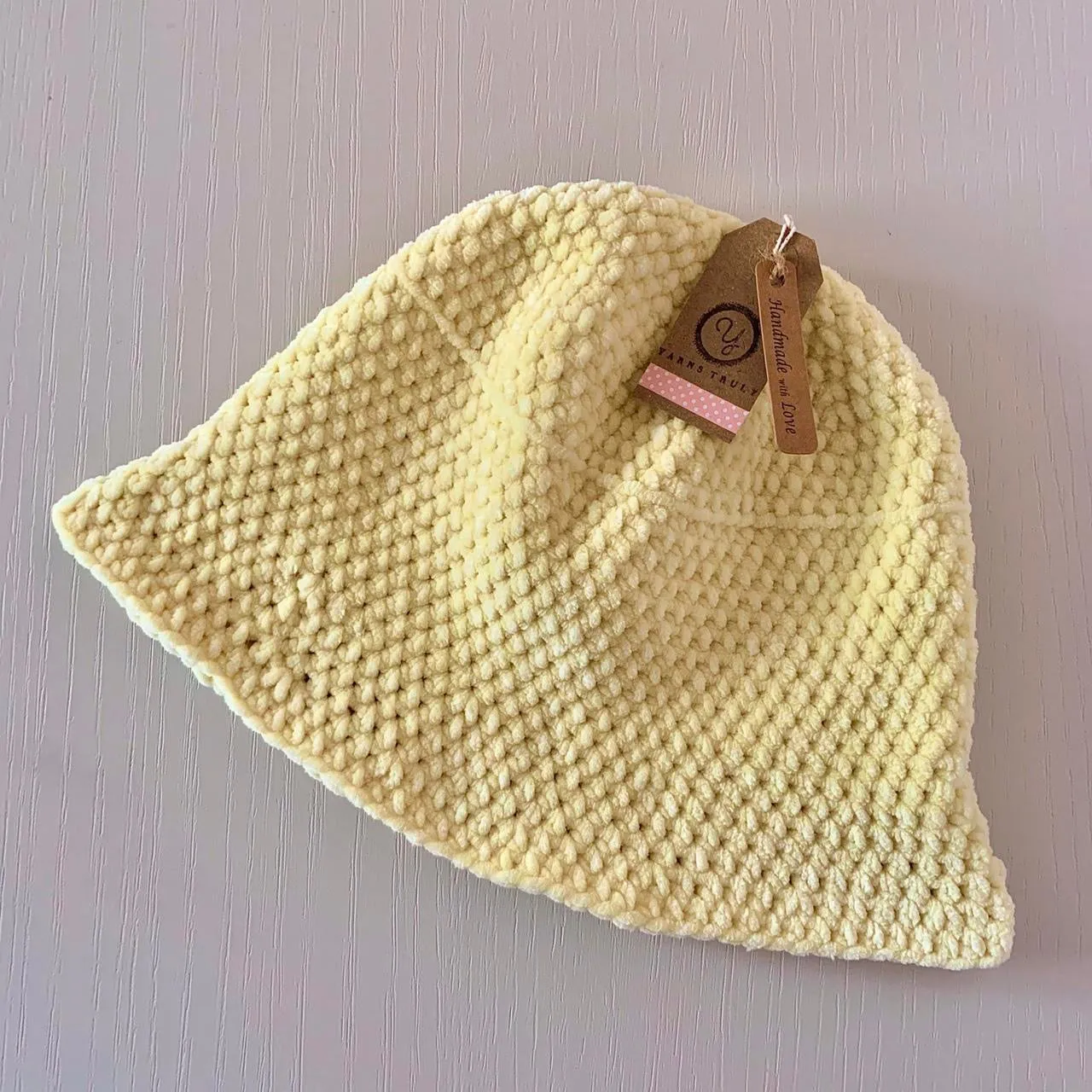 Handmade crushed velvet crochet bucket hat in pastel yellow