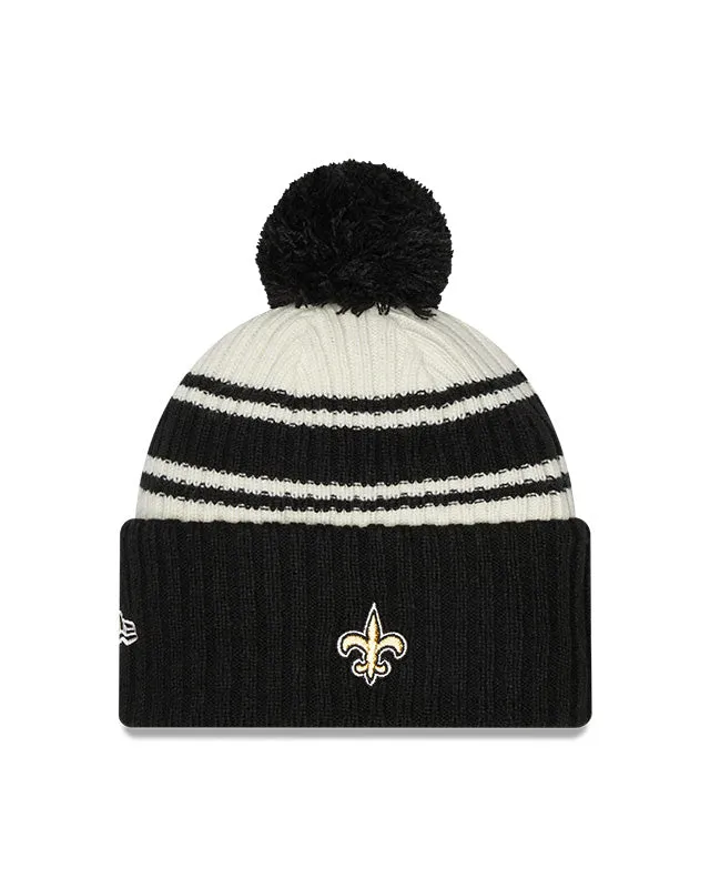 New Orleans Saints New Era 2022 Sideline - Sport Cuffed Pom Knit Hat - Cream/Black